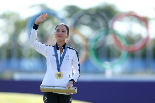 Gold medalist Lydia Ko of Team New Zealand celebrates on the podium during the Women's Individual Stroke Play medal ceremony at the Summer Olympics in Paris on Aug. 10. (Andrew Redington/Getty Images)