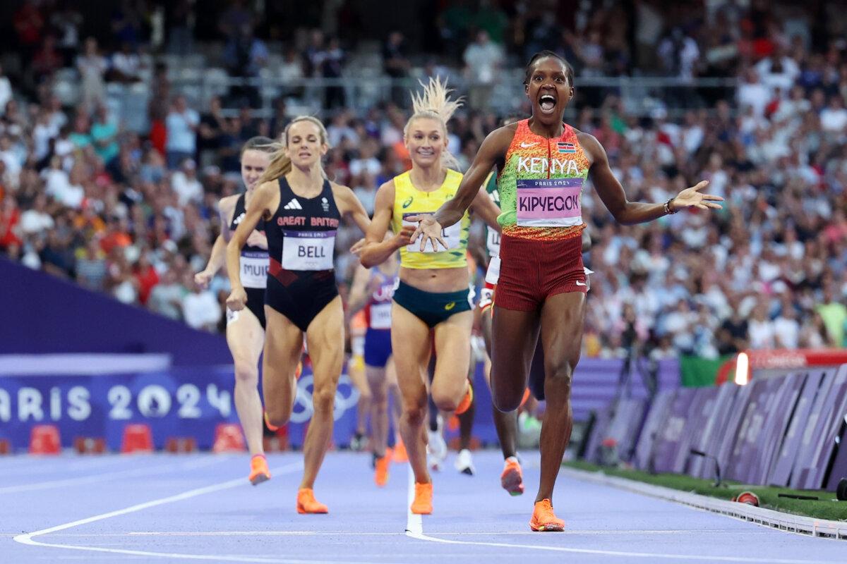 Faith Kipyegon of Team Kenya celebrates winning the gold medal and setting a new Olympic record in the Women's 1500m final on day 15 of the Olympic Games Paris 2024 at Stade de France in Paris on Aug. 10, 2024. (Hannah Peters/Getty Images)