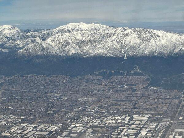 San Bernardino Mountains covered in snow are seen from a plane on approach of the Los Angeles airport on March 9, 2023. (Eva Hambach/AFP via Getty Images)