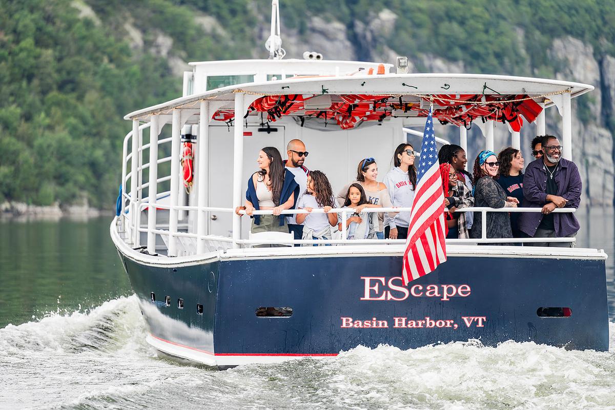 A group gets a guided ride around Lake Champlain on the EScape, Basin Harbor's touring boat. (Isora Lithgow Creations/Basin Harbor Resort)