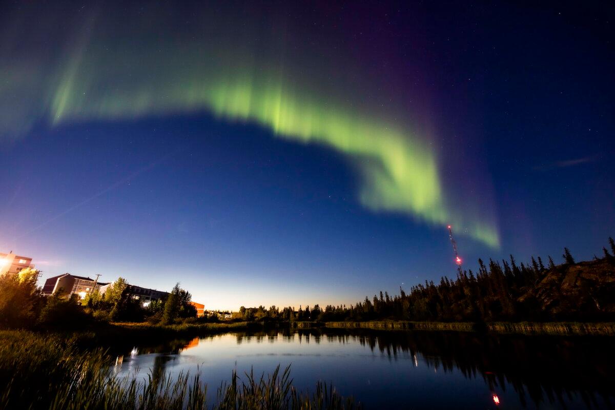 The northern lights, or the aurora borealis, appear in the sky over Rat Lake in Yellowknife, Northwest Territories, Canada, on Aug. 8, 2024. (Bill Braden/The Canadian Press via AP)