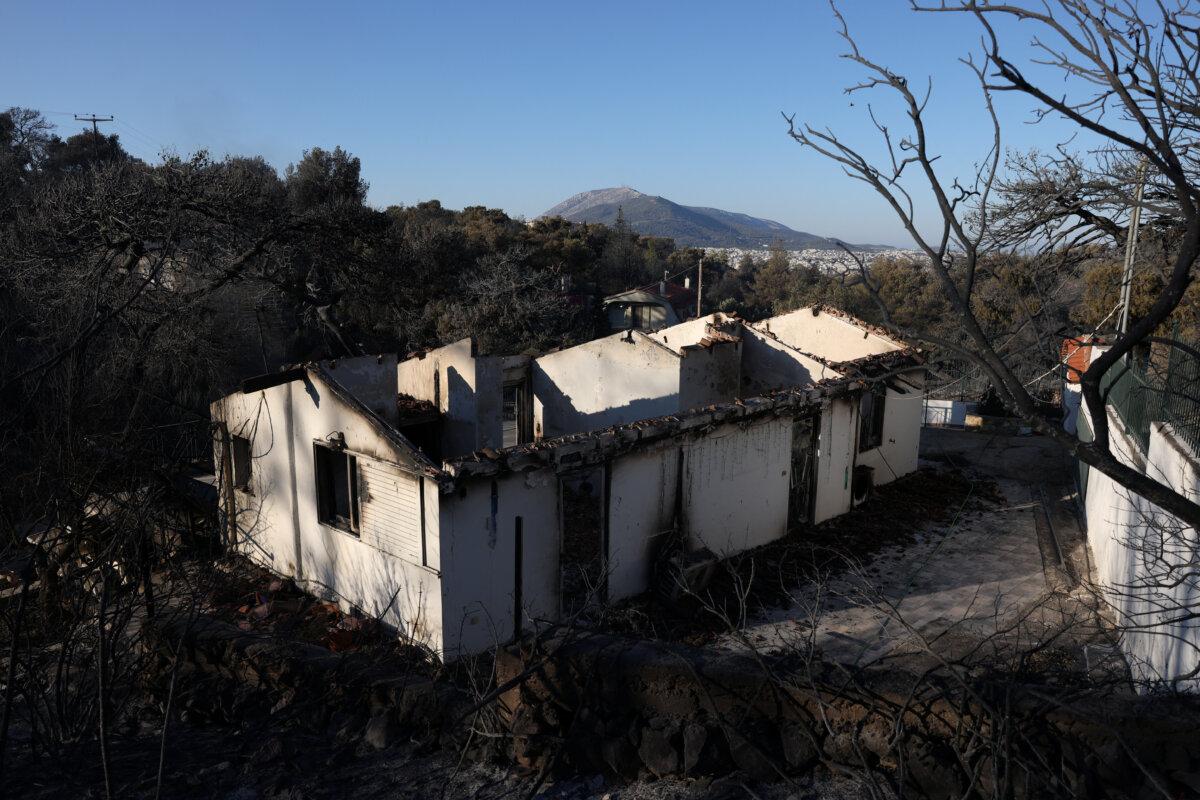 Burned houses are seen following a wildfire in the Penteli area near Athens, Greece, Aug. 13, 2024. (Reuters/Alexandros Avramidis)