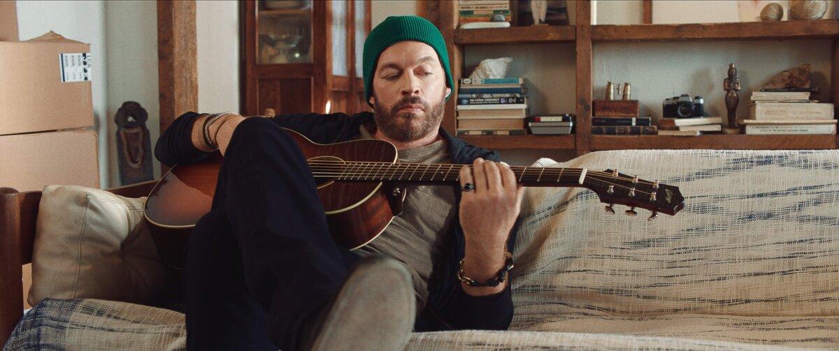 Songwriter-singer John Allman (Harry Connick Jr.) plays his music, in “Find Me Falling.” (MovieStillsDB)