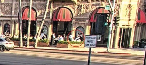 Two thieves rob a man of his watch at gunpoint on Aug. 7 outside the Beverly Wilshire Hotel. (Courtesy of the U.S. Attorney’s Office)