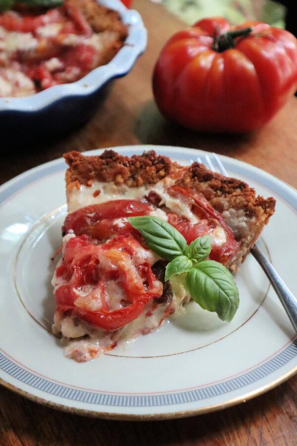 This Southern tomato pie is built on a cheesy, saltine cracker crust. (Gretchen McKay/Pittsburgh Post-Gazette/TNS)
