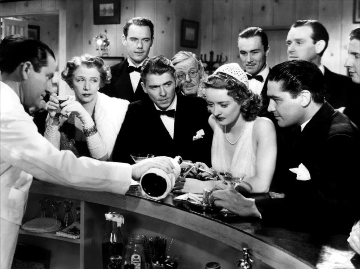 Ronald Reagan, (3rd from right, front) in 1937's "Dark Victory," which starred Bette Davis. (MovieStillDb)