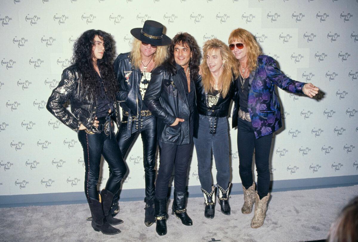 American rock band Great White attend the 17th Annual American Music Awards, held at the Shrine Auditorium in Los Angeles, Calif., Jan.22, 1990. Left to right: bass player Tony Montana, guitarist Mark Kendall, drummer Audie Desbrow, guitarist Michael Landrie and singer Jack Russell. (Vinnie Zuffante/Getty Images)