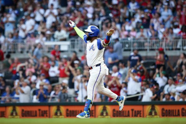 Marcell Ozuna (20) of the Atlanta Braves celebrates as he rounds the bases after a solo home run during the third inning against the Miami Marlins at Truist Park in Atlanta, Ga., on Aug. 3, 2024. (Casey Sykes/Getty Images)