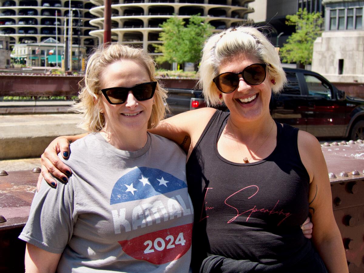 Sheila Mrotek (L) and Tracy Grundy are visiting Chicago from Wisconsin to support Vice President Kamala Harris during the Democratic National Convention. (Travis Gillmore/The Epoch Times)