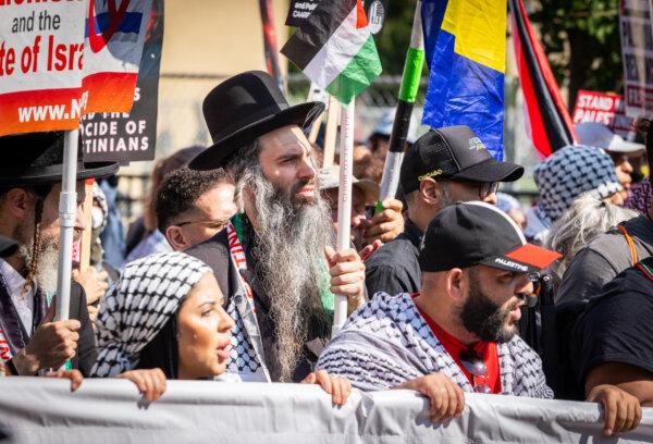 Pro-Palestinian protesters march near the 2024 DNC grounds in Chicago, Ill., on Aug. 19, 2024. (John Fredricks/The Epoch Times)