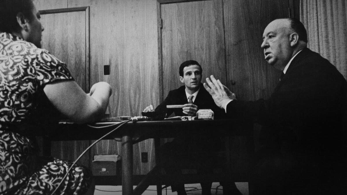 (L–R) Translator Helen Scott, François Truffaut, and Alfred Hitchcock, in the documentary “Hitchcock/Truffaut.” (Cohen Media Group) <span style="color: #ff0000;"> </span>