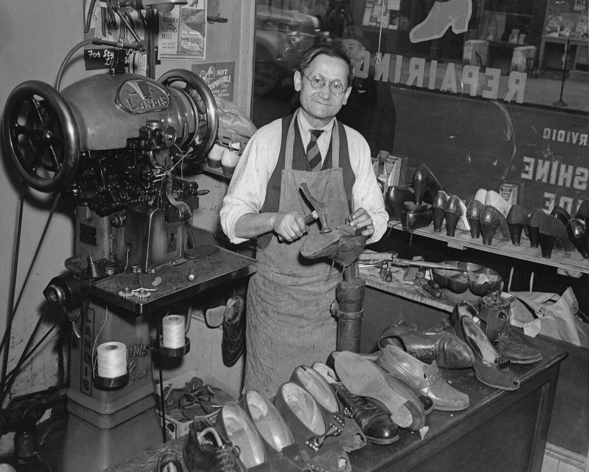 A cobbler in his workshop repairing shoes in the 1940's. (FPG/Getty Images)