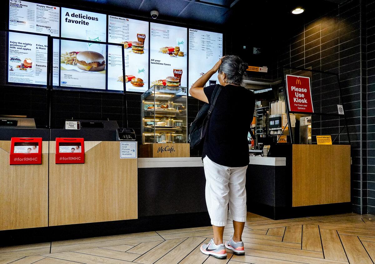 A customer waits to order food at a McDonald's fast-food restaurant in Miami on July 26, 2022. (Joe Raedle/Getty Images)
