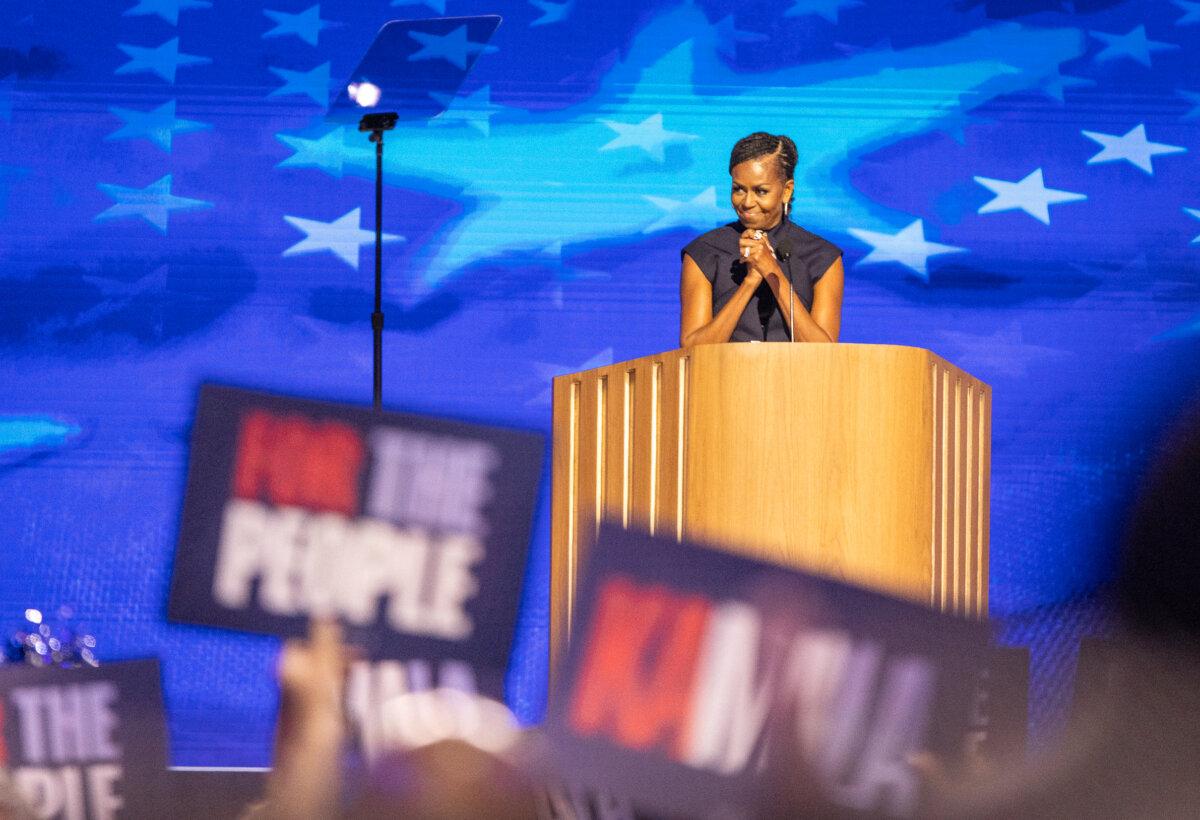 Former First Lady Michelle Obama speaks on night two of the 2024 DNC held in Chicago on Aug. 20, 2024. (John Fredricks/The Epoch Times)