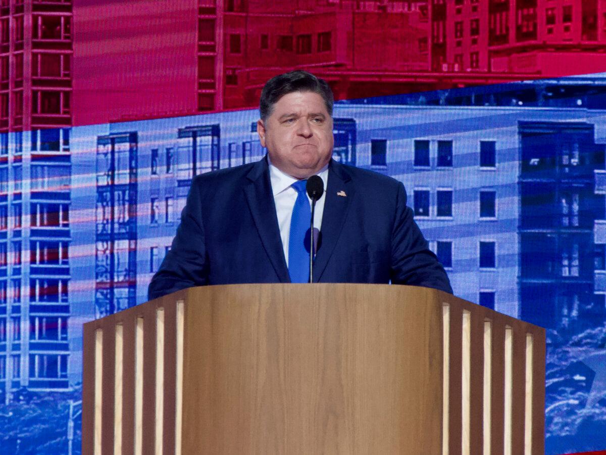 Illinois Gov. JB Pritzker addresses the crowd at the Democratic National Convention in Chicago on Aug. 20, 2024. (Travis Gillmore/The Epoch Times)