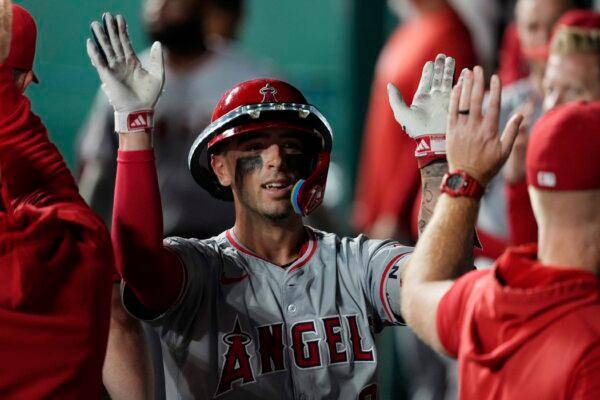 Zach Neto (9) of the Los Angeles Angels is congratulated by teammates after hitting a home run in the sixth inning against the Kansas City Royals at Kauffman Stadium in Kansas City on Aug. 20, 2024. (Ed Zurga/Getty Images)