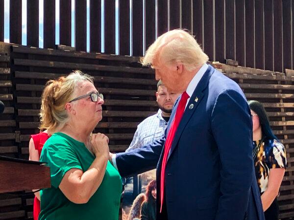 Former President Donald Trump (R) with Patty Morin (L), mother of murdered Rachel Morin, during a visit to the border wall at Montezuma Pass, Cochise County, Ariz., on Aug. 22, 2024. (Janice Hisle/The Epoch Times)