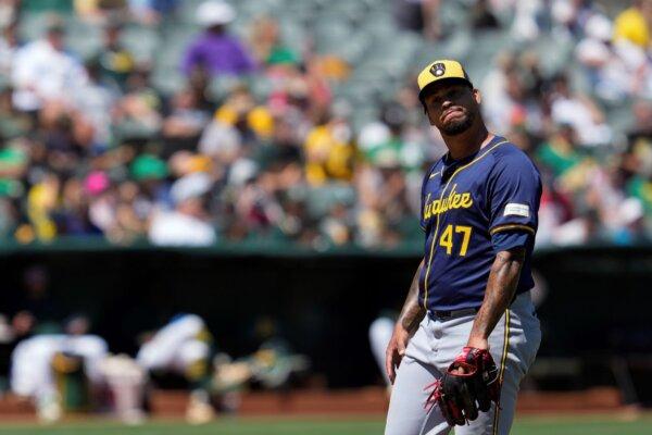 Former A's pitcher Frankie Montas of the Brewers reacts after walking in a run in Oakland, Calif., on Aug. 25, 2024. (Godofredo A. Vásquez/AP Photo)