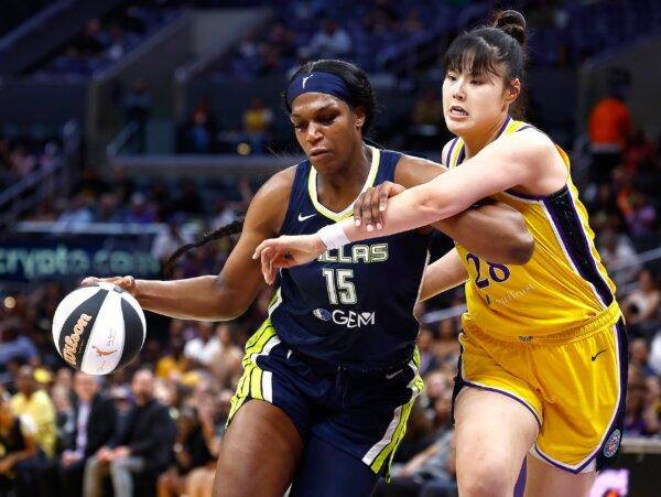 Teaira McCowan (15) of the Dallas Wings controls the ball against Li Yueru (28) of the Los Angeles Sparks in the first half in Los Angeles on June 7, 2024. (Ronald Martinez/Getty Images)