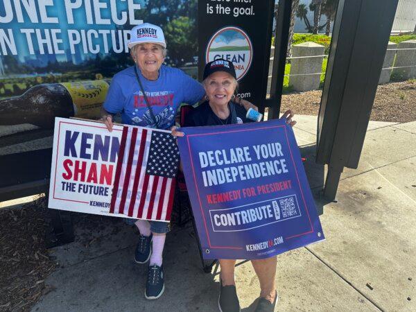 From left: Peggy Merizalde of Santa Barbara and Susan Davi, of Palm Desert joined a rally for Team Kennedy on Aug. 25, 2024, on Wilshire Boulevard near Beverly Hills, Calif. (Jill McLaughlin/The Epoch Times)