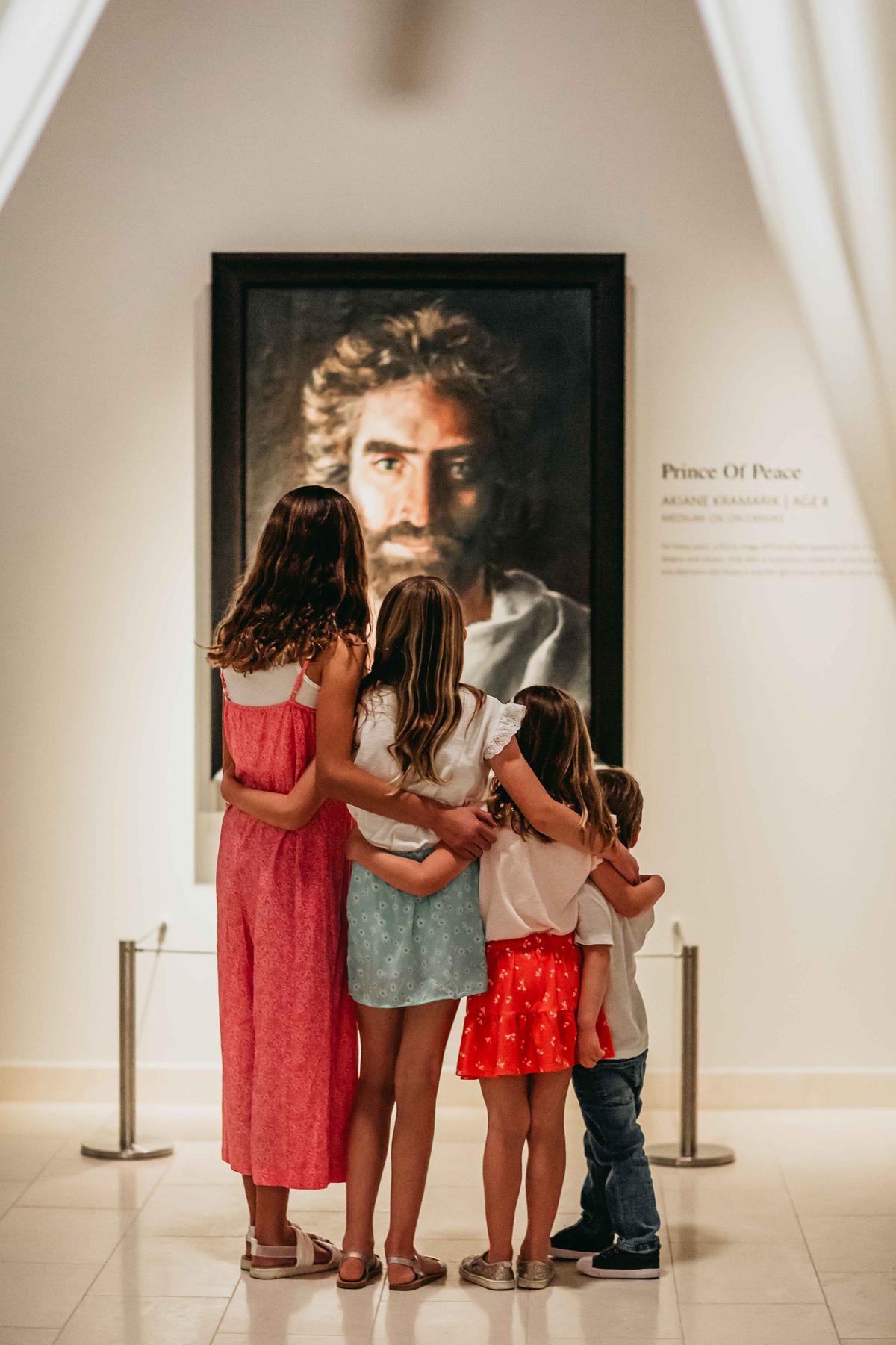 Gallery visitors admire "Prince of Peace," by Akiane Kramarik, which was recovered from a storage unit near Los Angeles. (Courtesy of the Belóved Gallery)