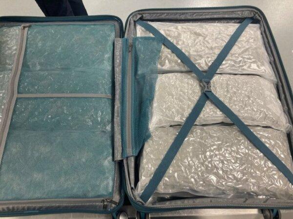 A suitcase filled with vacuum-packed cannabis, found when a passenger arrived from Phuket, Thailand, at Heathrow Airport in London on Feb. 14, 2024. (National Crime Agency)