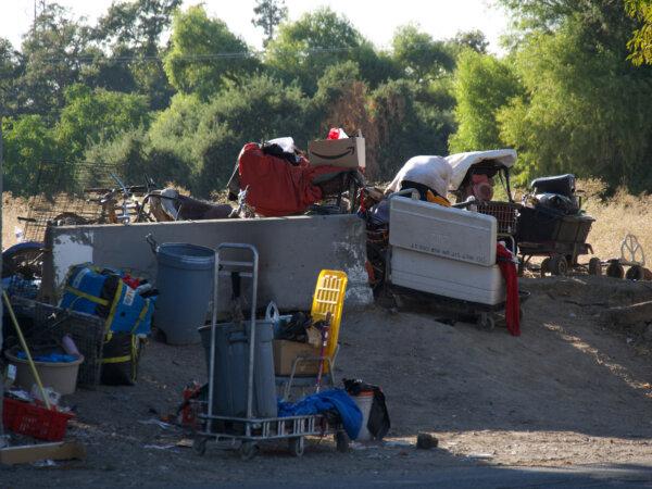 Items near the old site of Camp Resolution after the homeless camp was swept the day before, on Aug. 27. (Travis Gillmore/The Epoch Times)