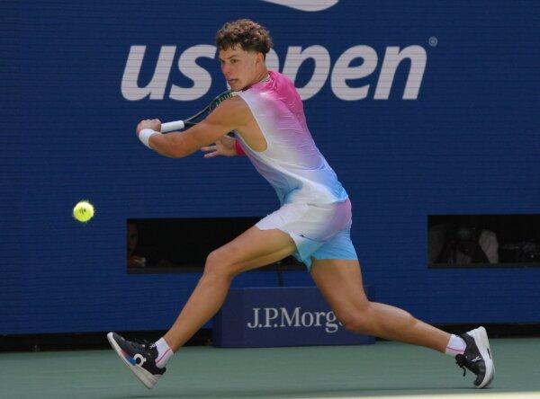 USA's Ben Shelton hits a return to Austria's Dominic Thiem during their men's singles first round tennis match on day one of the US Open tennis tournament in New York City, on Aug. 26, 2024. (Timothy A. Clary/AFP/Getty Images)
