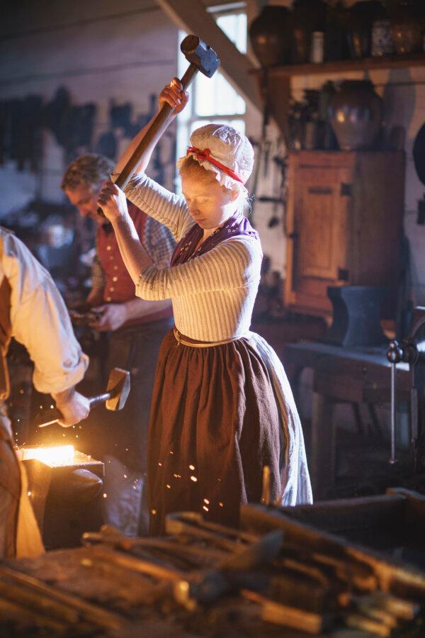 Blacksmith Aislinn Lewis works at a forge in the James Anderson Blacksmith Shop & Public Armoury in Colonial Williamsburg’s Historic Area. (Darnell Vennie/The Colonial Williamsburg Foundation/TNS)