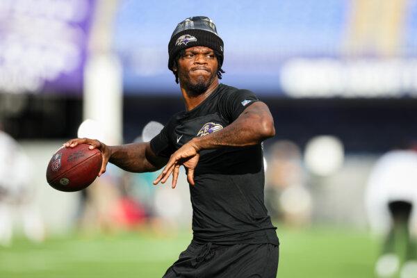 Lamar Jackson of the Baltimore Ravens warms up before a preseason game against the Philadelphia Eagles in Baltimore on Aug. 9, 2024. (Scott Taetsch/Getty Images)