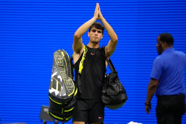 Carlos Alcaraz gestures to fans after losing to Botic van De Zandschulp in a second round match of the U.S. Open tennis championships, in New York on Aug. 29, 2024. (Frank Franklin II/AP Photo)