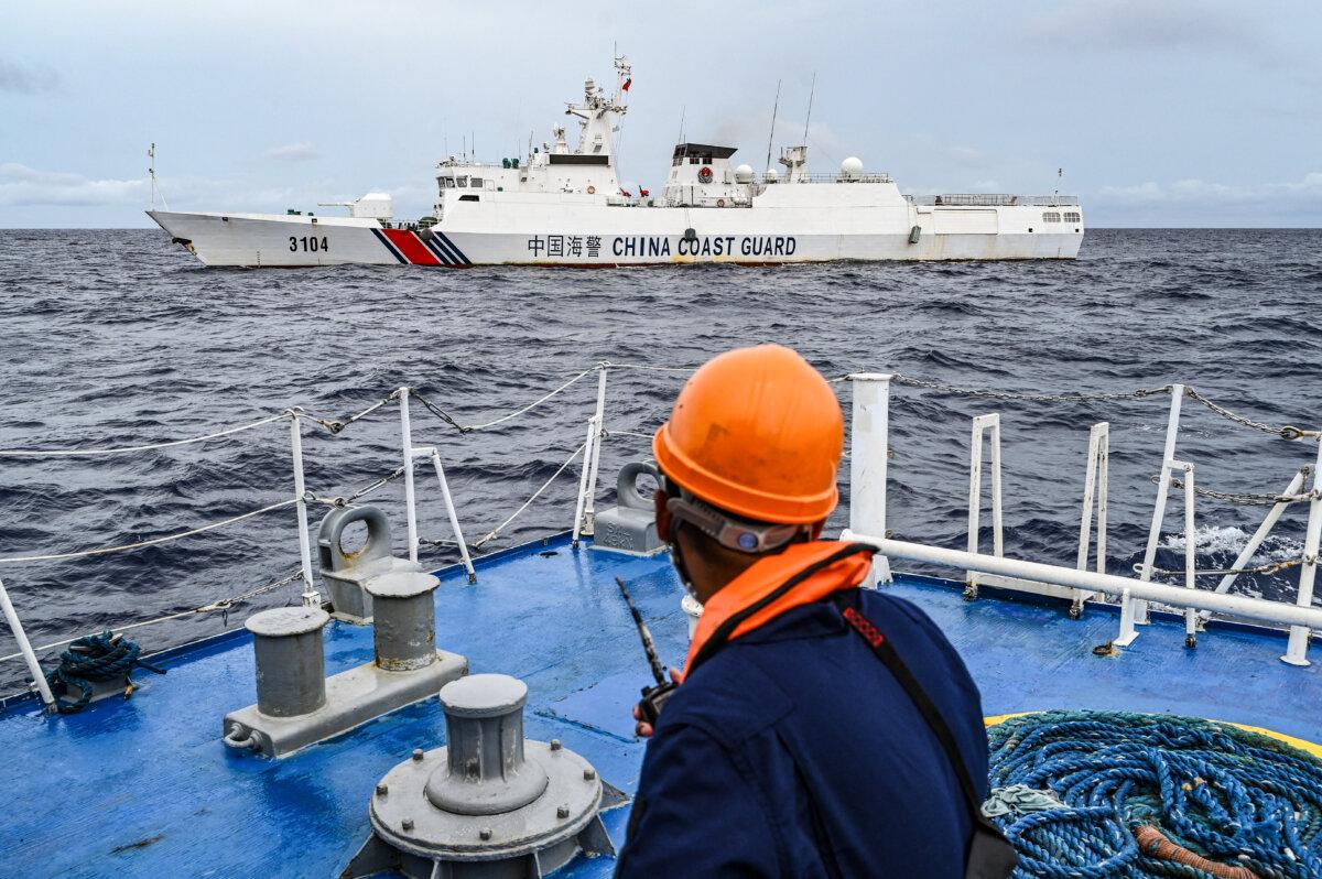 A China Coast Guard ship is seen from the Philippine Coast Guard vessel BRP Cabra during a supply mission to Sabina Shoal in disputed waters of the South China Sea on Aug. 26, 2024. (Jam Sta Rosa/AFP via Getty Images)