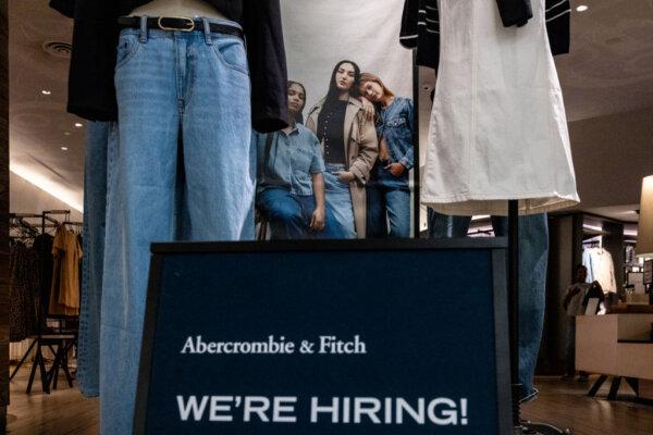 A hiring sign is displayed in front of Abercrombie & Fitch at the Tysons Corner Center mall on August 22, 2024 in Tysons, Virginia. According to reports, over 800,000 fewer jobs were created within the U.S. economy than originally reported in the 12-month period, 30% less than the previously reported 2.9 million from April 2023 through March, 2024. (Photo by Anna Rose Layden/Getty Images)