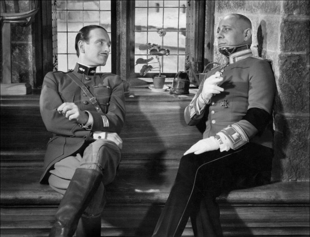 Capt. Boeldieu (Pierre Fresnay, L) enjoys the company of fellow aristocrat Capt. von Rauffenstein (Erich von Stroheim), in “The Grand Illusion.” (Réalisation d'Art Cinématographique)