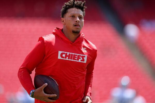 Chiefs quarterback Patrick Mahomes runs during pregame warmups before a preseason contest against the Detroit Lions in Kansas City, Mo., on Aug. 17, 2024. (David Eulitt/Getty Images)