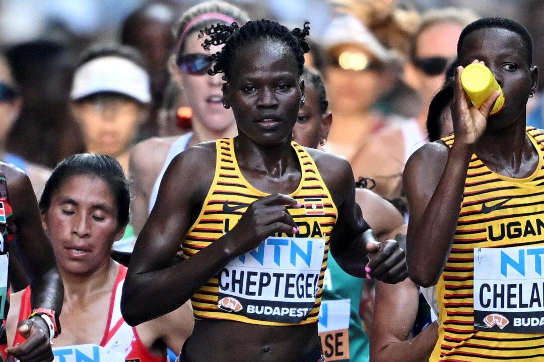 Alleged Killer of Ugandan Olympian Dies From Burns, Hospital Says