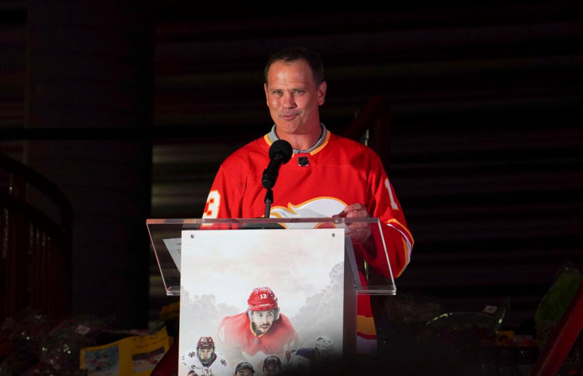 Flames general manager Craig Conroy speaks at the candlelight vigil honouring former Calgary Flames star Johnny Gaudreau and his brother Matthew outside the Scotiabank Saddledome in Calgary on Sept. 4, 2024. (Carolina Avendano/The Epoch Times)