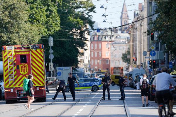 Police officers block a street after police shot and killed an 18-year-old who allegedly attacked the Israeli Consulate in Munich, Germany, on Sept. 5, 2024. (AP Photo/Matthias Schrader)