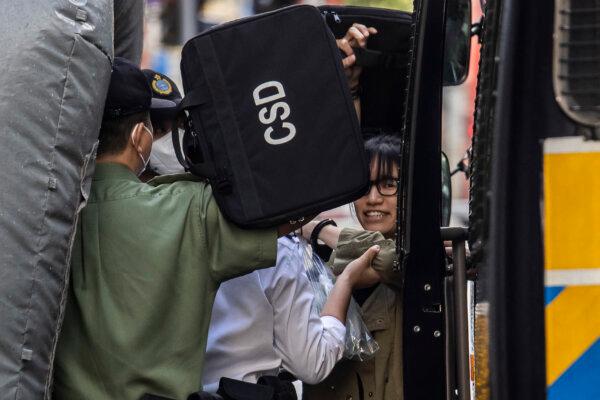 Chow Hang-tung (R), a leader of a Hong Kong Alliance that organized vigils marking the Tiananmen Square massacre, arrives at the Court of Final Appeal in Hong Kong on June 8, 2023. (Isaac Lawrence/AFP via Getty Images)