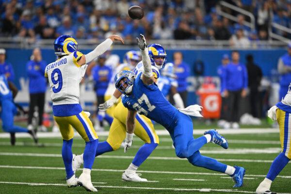 Detroit Lions defensive end Aidan Hutchinson (97) pressures Los Angeles Rams quarterback Matthew Stafford (9) during the first half of an NFL football game in Detroit on Sept. 8, 2024. (David Dermer/AP Photo)