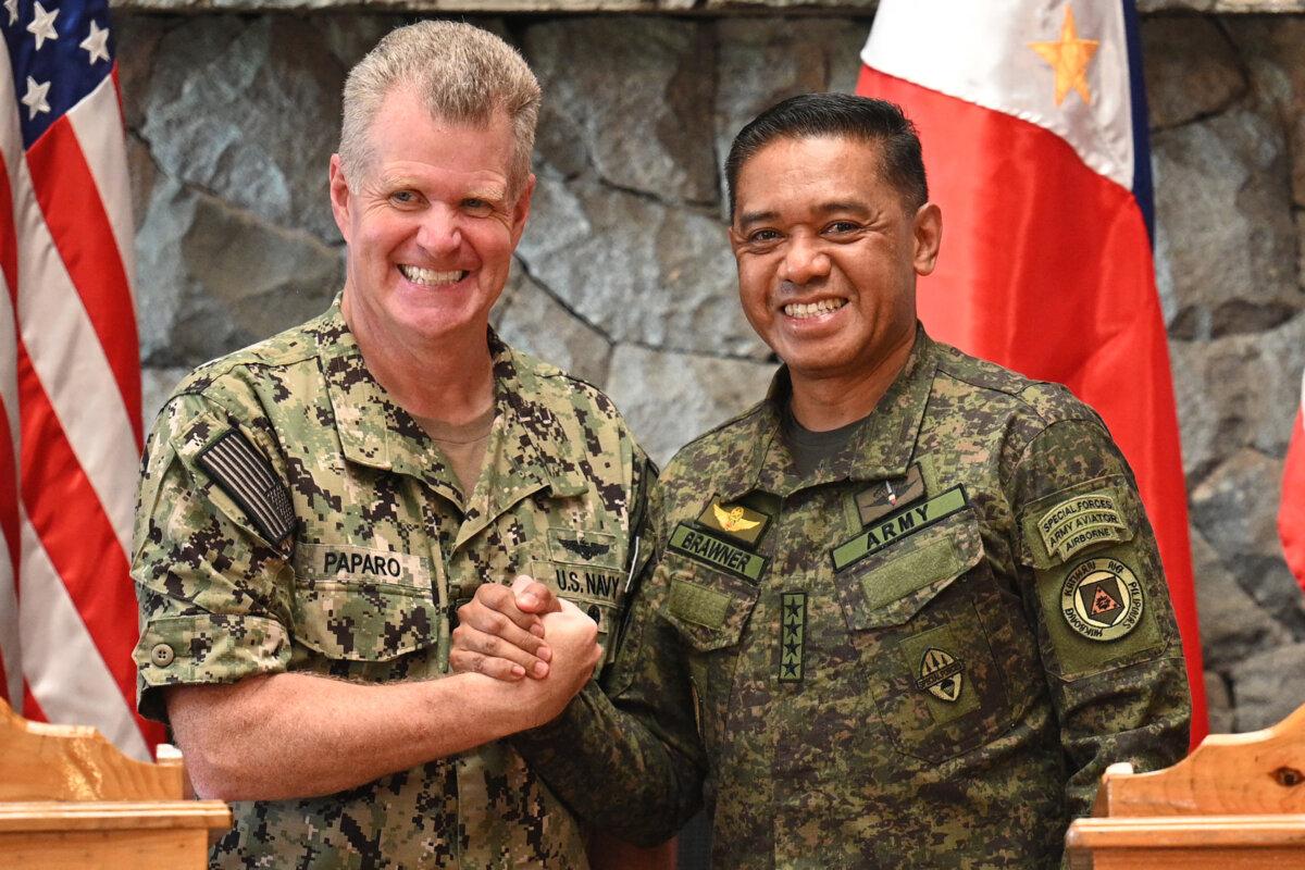 U.S. Indo-Pacific Commander Adm. Samuel Paparo (L) shakes hands with Philippine Military Chief Gen. Romeo Brawner during a joint press conference in Baguio, Philippines, on Aug. 29, 2024. (Ted Aljibe/AFP via Getty Images)
