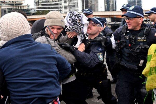 Protesters confront police outside the Land Forces 2024 arms fair in Melbourne, Australia, on Sept. 11, 2024. (William West/AFP via Getty Images)