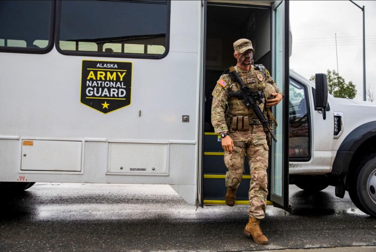 Staff Sgt. Daniel Abbott steps off the bus to travel to Black Rapids Training Center in Alaska on July 10, 2023. (Staff Sgt. Tori Miller/U.S. Army)