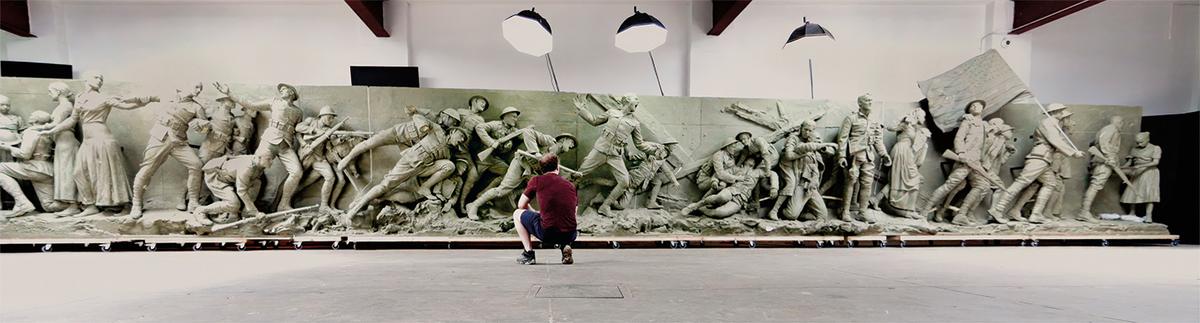 Howard analyzes his full size relief of “A Soldier’s Journey,” featuring 38 figures spread across 58 feet. The figures were cast in bronze for the installed memorial in Washington. (Courtesy of Sabin Howard)