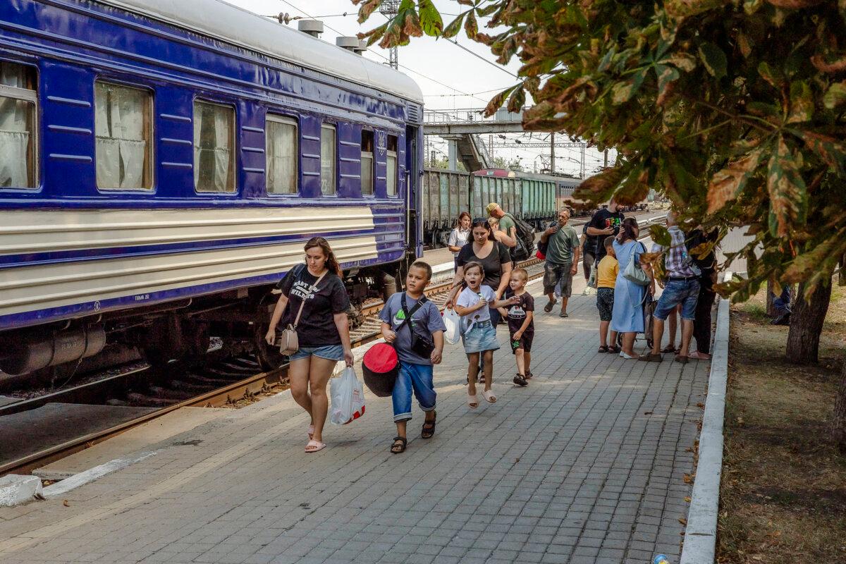 Amid Russia's continued westward advance, women and children board an evacuation train in Pokrovsk, Donetsk region, Russia, on Aug. 2, 2024. (Roman Pilipey/AFP via Getty Images)