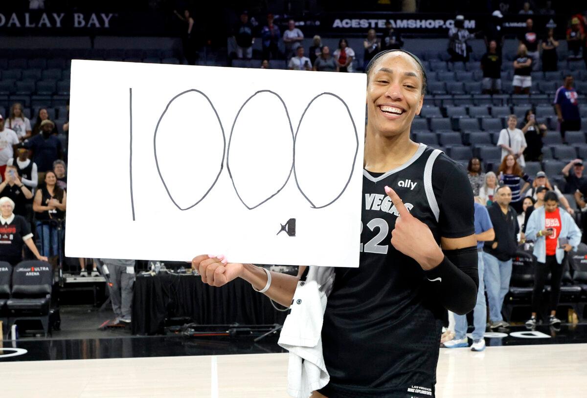 Las Vegas Aces center A'ja Wilson (22) poses after an WNBA basketball game against the Connecticut Sun in Las Vegas on Sept. 15, 2024. (Steve Marcus/Las Vegas Sun via AP)