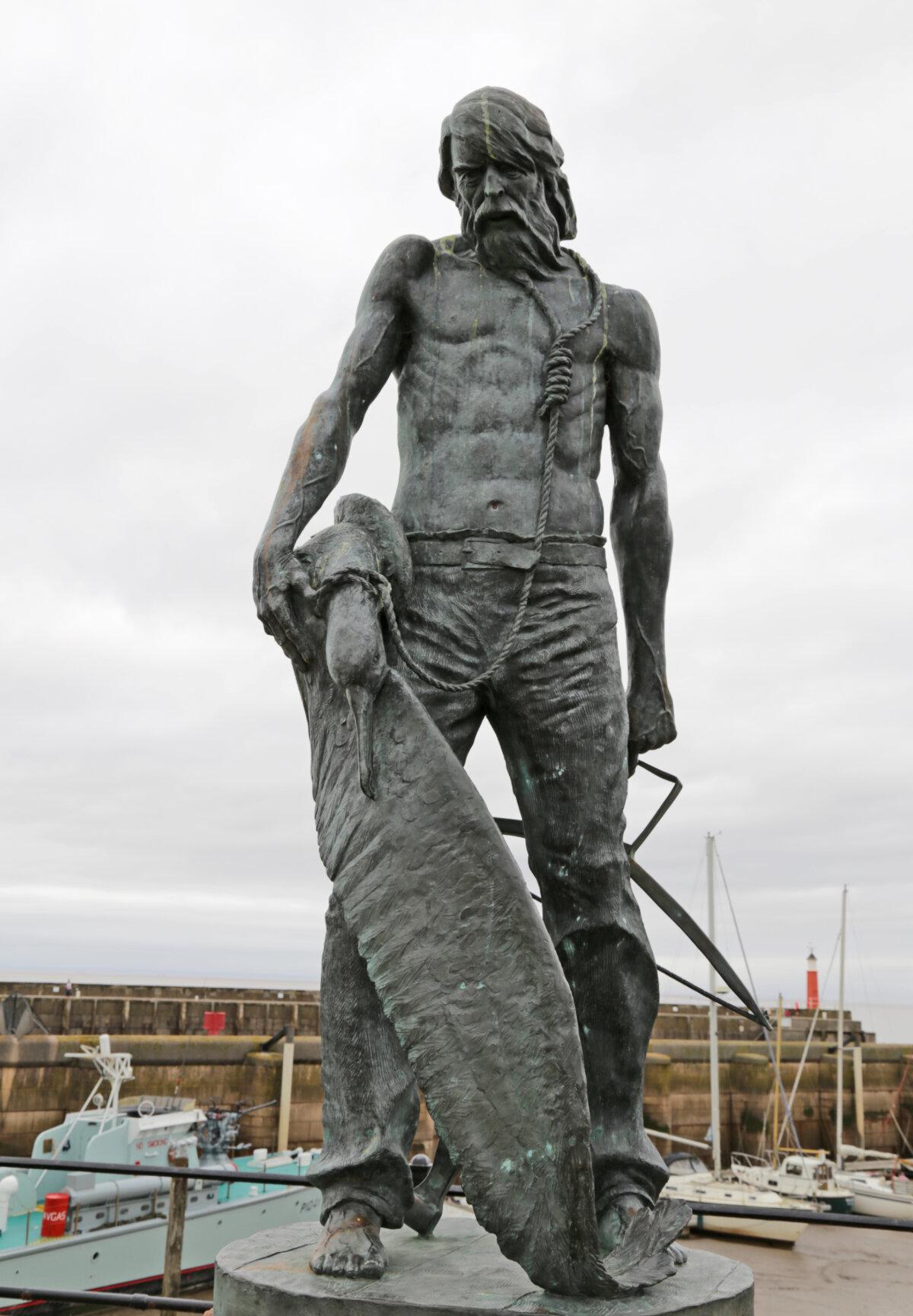 Commemorative statue of the Ancient Mariner at Watchet, Somerset, England, by Alan B. Herriot: The albatross hangs on a rope looped around the ancient mariner's neck. "Ah! well a-day! what evil looks Had I from old and young! Instead of the cross, the Albatross About my neck was hung." (<a href="https://www.geograph.org.uk/profile/60940?__cf_chl_f_tk=CCqRpreABcw1y08mKMmS64CqmvUX0qfxRd19IW3_2Ok-1783351946-1.0.1.1-2Ai8h6OI2RdNnXtJMT2deKYFI_PJzTJsxnxW.nPsHNs">Peter Turner</a>/<a href="https://creativecommons.org/licenses/by-sa/2.0/">CC BY-SA 2.0</a>)