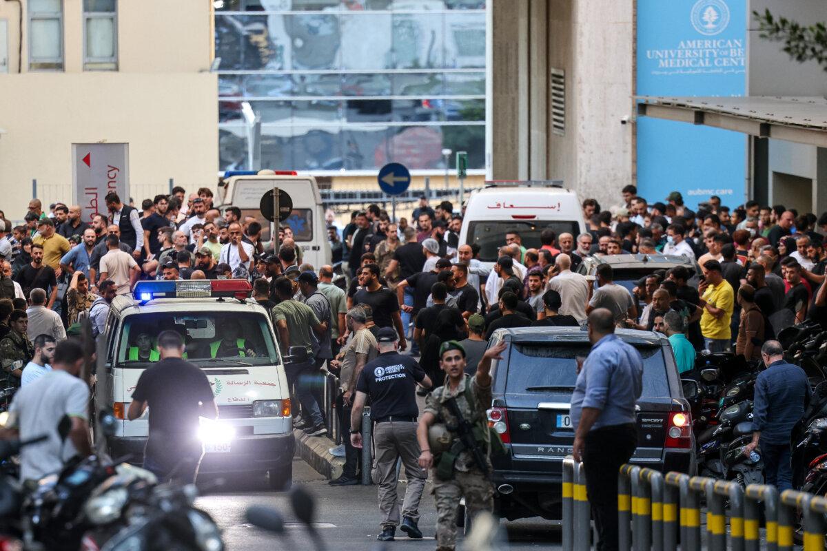 Thousands Injured in Series of Pager Explosions Across Lebanon, Officials Say | USNN World News Ambulances are surrounded by people at the entrance of the American University of Beirut Medical Center after pager explosions hit locations in several Hezbollah strongholds around Lebanon amid ongoing cross-border tensions between Israel and Hezbollah fighters, in Beirut, Lebanon, on Sept. 17, 2024. (Anwar Amro/AFP via Getty Images)