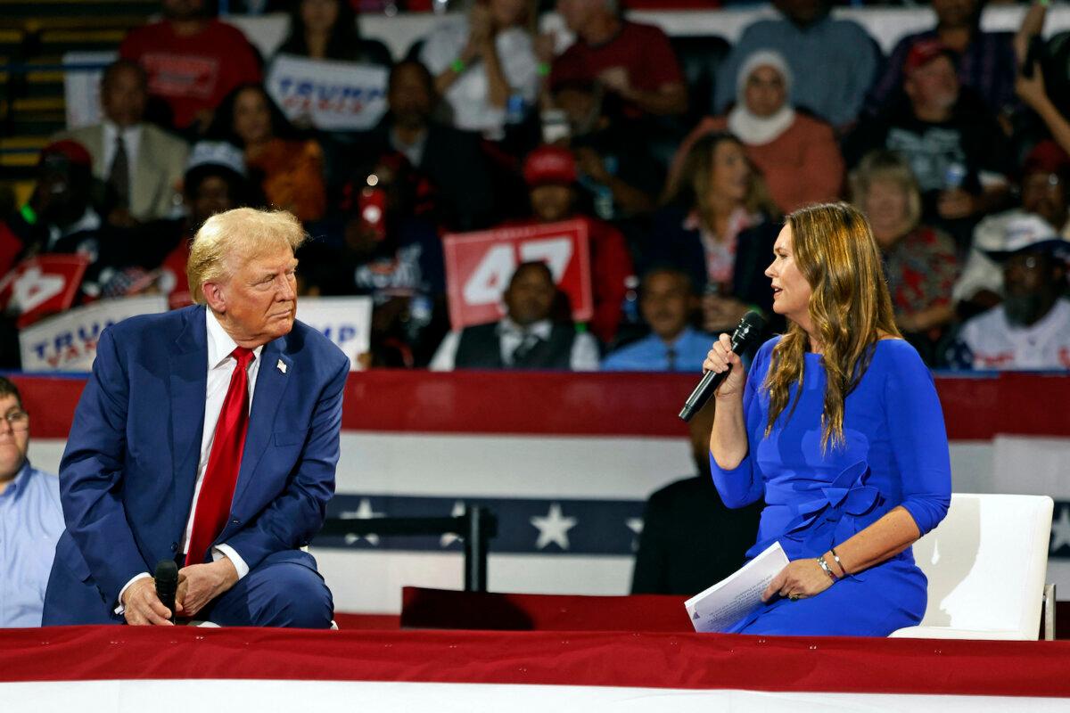 Former President and Republican presidential candidate Donald Trump attends a town hall meeting moderated by Arkansas Gov. Sarah Huckabee Sanders (R) at the Dort Financial Center in Flint, Mich., on Sept. 17, 2024. (Jeff Kowalsky/AFP via Getty Images)