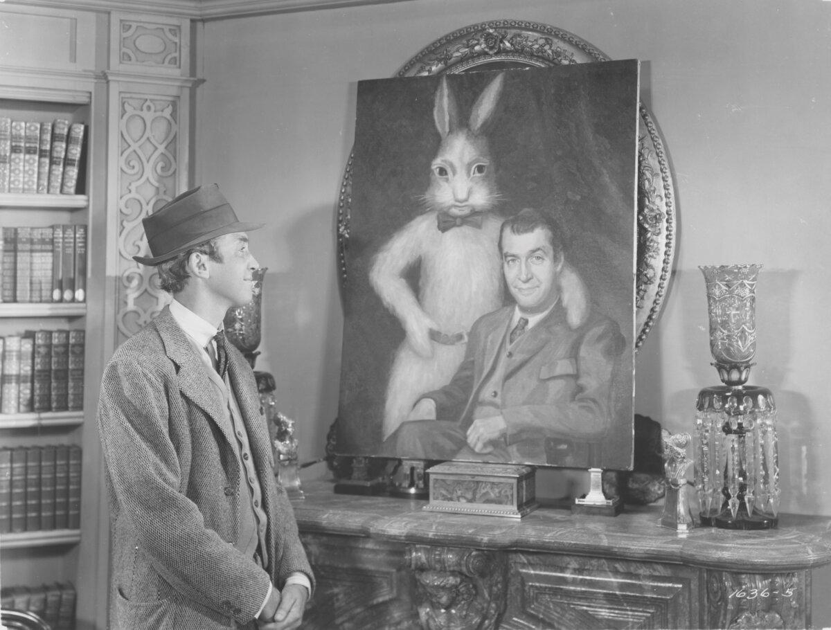 Elwood P. Dowd (James Stewart) admires a painting, in "Harvey." (MovieStillsDB)